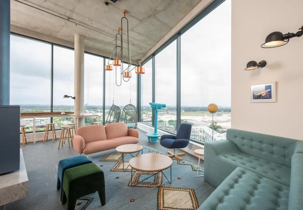 Lounge with airport views at Citadines Connect Sydney Airport